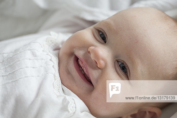 Portrait of smiling baby girl  close-up