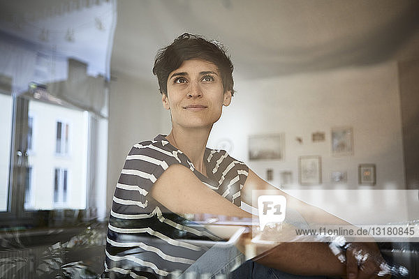 Portrait of woman at home thinking