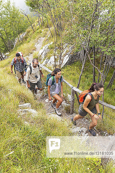 Italy  Massa  group of young people hiking in the Alpi Apuane mountains