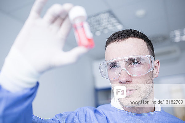 Scientist in lab examining sample