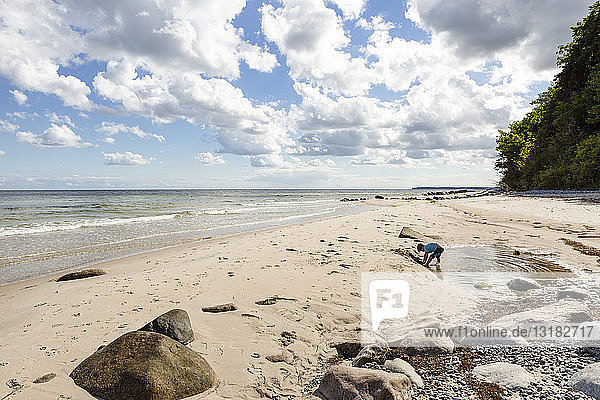 Boy playing at the beach