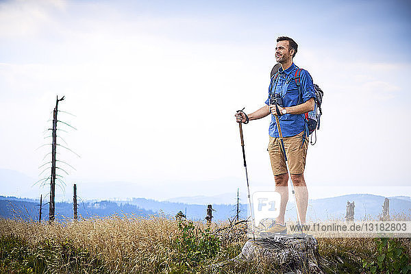 Man admiring the view during hiking trip