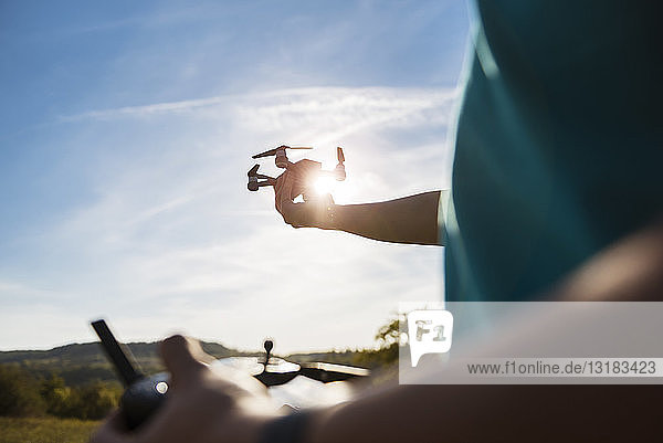 Boy flying a drone outdoors