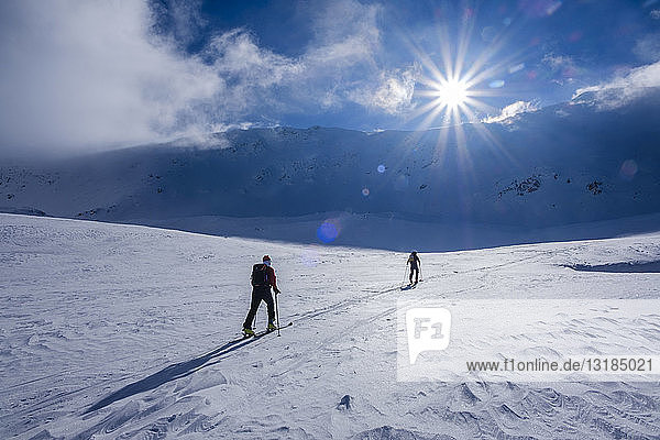 Two men doing a ski tour in Faragas mountains  Southern Carpathians  Romania