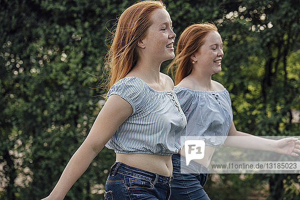 Redheaded twins running