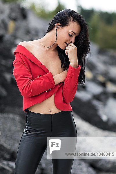 Woman with red jacket and black leggings