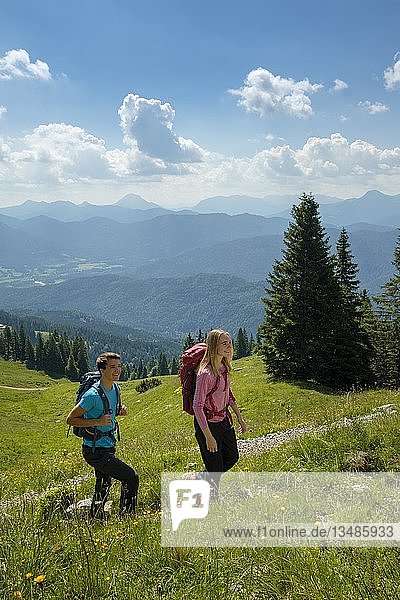Young couple mountaineering  hiking  Brauneck near Lenggries  Isarwinkel  Alps  Upper Bavaria  Bavaria  Germany  Europe