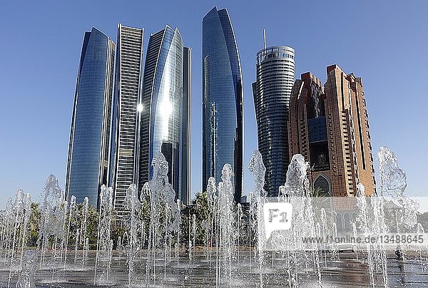 Trick fountains in front of skyscrapers  Abu Dhabi  United Arab Emirates  Asia