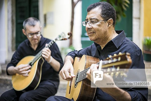 Two fado guitarists with acoustic and portuguese guitars in Alfama  Lisbon  Portugal  Europe