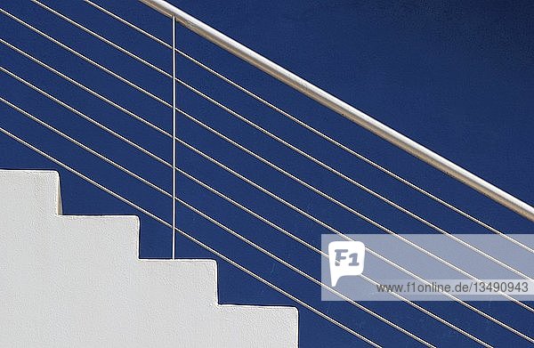 White steps in front of a blue wall