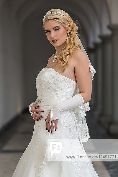 Portrait of a young woman in a white wedding dress