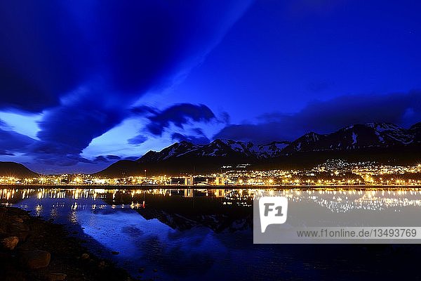 The city lights are reflected in the Beagle Channel in the blue hour  Ushuaia  Tierra del Fuego Province  Tierra del Fuego  Argentina  South America