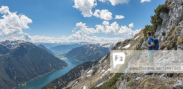 Hiker on the way to the summit of the Seekarspitz  view over the lake Achensee  Tyrol  Austria  Europe