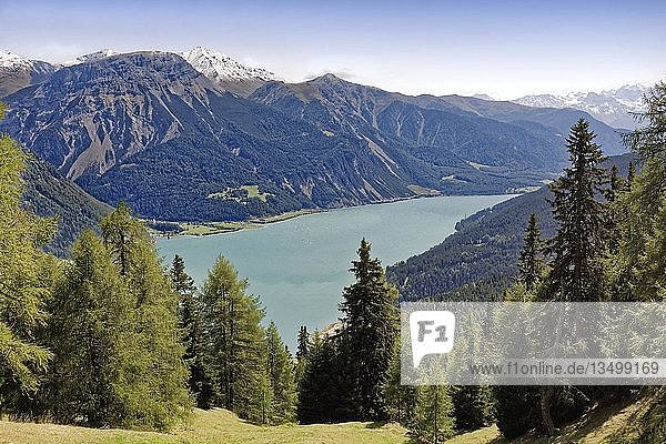 Lake Reschensee  reservoir  behind Grauner Berg or Monte Curon 2526m  Reschen am Reschenpass  Vinschgau  Trentino-South Tyrol  Italy  Europe