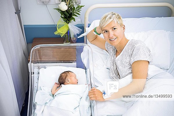 Happy mother enjoying her newborn baby boy still in the hospital  Poland  Europe