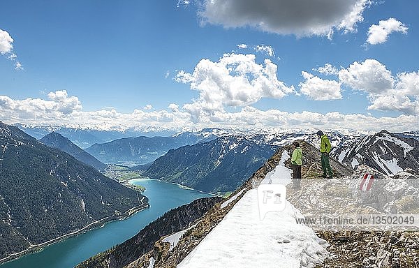 Two hikers on the summit of Seekarspitz  view over the lake Achensee  Tyrol  Austria  Europe