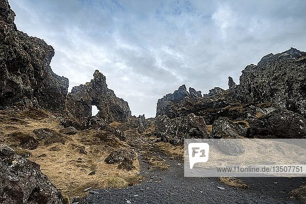 Rock arch volcanic rock on the beach of Djúpalónssandur Snæfellsnes peninsula West Iceland Iceland Europe
