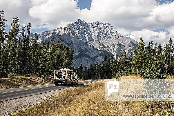Motorhome on road in front of spectacular mountain scenery in autumn  Mount Cascade Mountain  Banff  Banff National Park  Rocky Mountains  Alberta  Canada  North America