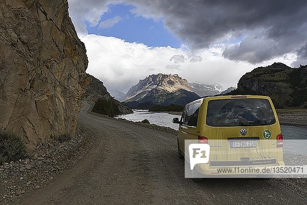 Yellow travel minibus on road to Lago del Desierto at Rio de las Vueltas near El Chalten Patagonia Argentina South America