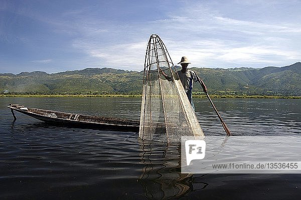 One-legged man in a rowboat  Inle Lake  Shan State  Burma  (Myanmar)  Southeast Asia