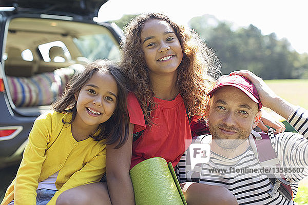 Portrait happy father and daughters