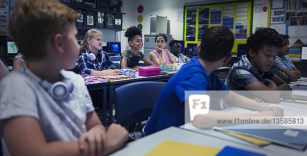 Junior high school students at desks in classroom