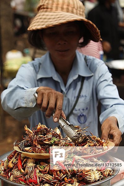 Woman selling crabs   Udong  Cambodia.