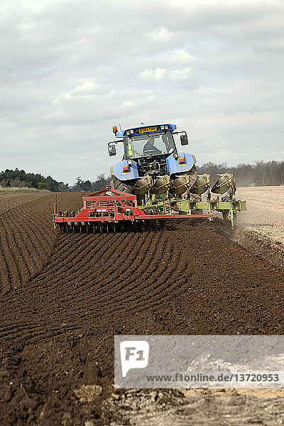 New Holland tractor disc harrowing field  Sutton  Suffolk  England