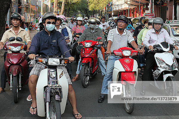 Rush Hour Moped Commuters Crowding Street