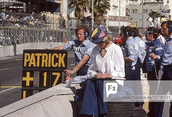 Signalling Patrick Depailler in the Tyrrell-Cosworth 007  finished 3rd US GP West  Long Beach  California  USA 28 March 1976.