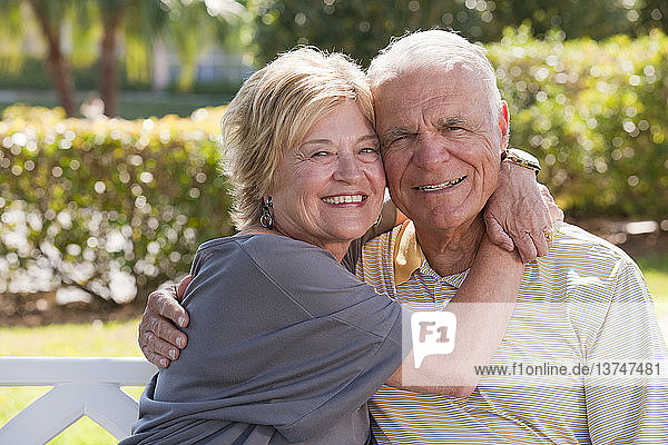 Portrait of a romantic senior couple in a park