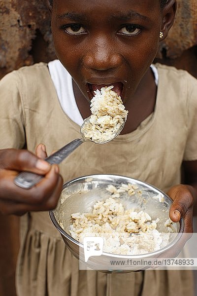 African girl eating rice  Lome  Togo.