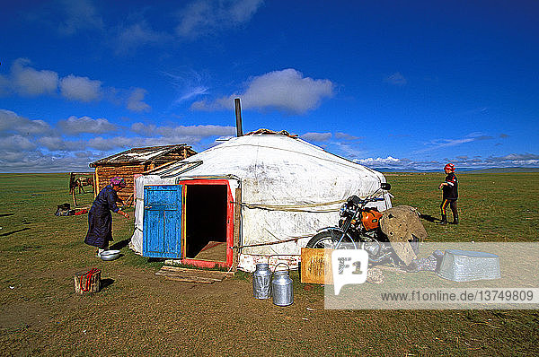 Family around their yurt in Northern Mongolia