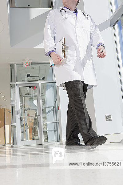 Male doctor walking in a corridor of a hospital