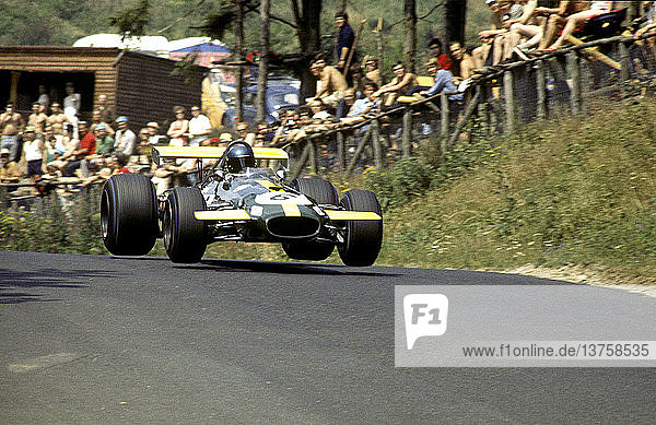 German GP winner Jacky Ickx in works Brabham BT26A leading an F2 Matra into the Sudkehre corner. Nurburgring  Germany 1969.
