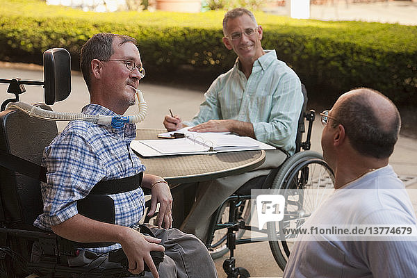 Disabled businessmen doing paperwork