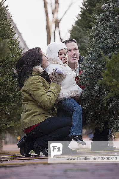 Family picking out a Christmas tree