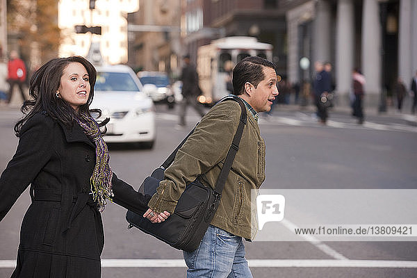 Couple crossing a street