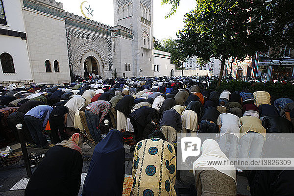 Muslims praying outside the Paris Great Mosque on Eid El-Fitr festival