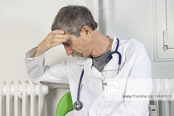 A doctor exhausted by his work.