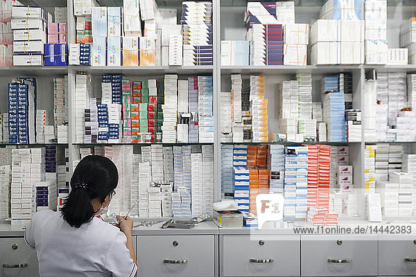 Hospital pharmacy. Pharmacist at work. Tam Duc Cardiology Hospital.. Ho Chi Minh City. Vietnam.