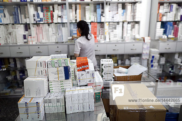 Hospital pharmacy. Pharmacist checking inventory. Tam Duc Cardiology Hospital.. Ho Chi Minh City. Vietnam.