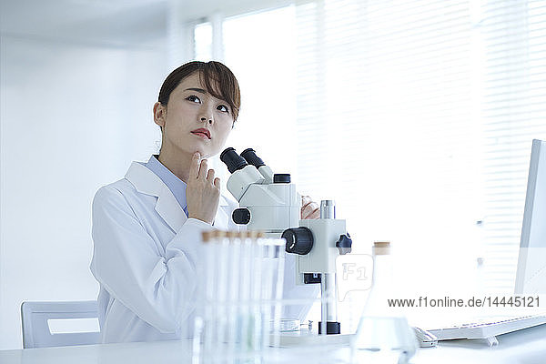 Young Japanese researcher in the lab
