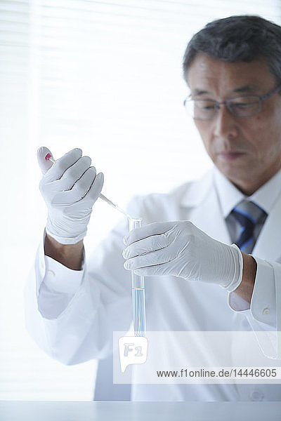 Senior Japanese researcher in the lab