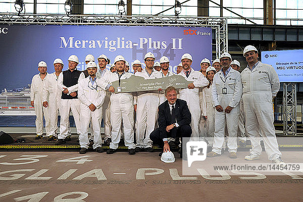 France  region of Pays de La Loire  shipyard STX in Saint-Nazaire city  ceremony first steel cutting new liner for MSC Company  Pierfrancesco Vago chairman of MSC Cruises with collaborators present model of future ship.