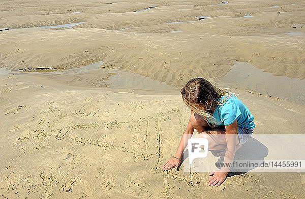 France  South-Western France  Gironde Estuary  little girl on the sand bank of the Cordouan lighthouse at low tide