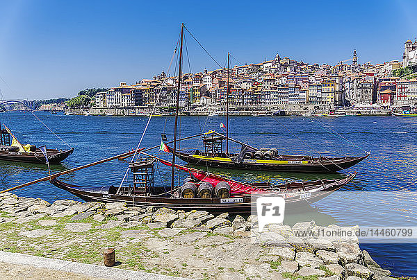 Ships used to carry port wine  moored in Vila Nova de Gaia on the Douro River  with Ribeira in the background  Porto  Portugal