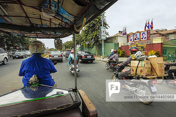 Passenger view from moving remork-moto (motorcycle and carriage)  typical cheap transport here  City centre  Phnom Penh  Cambodia  Indochina  Southeast Asia