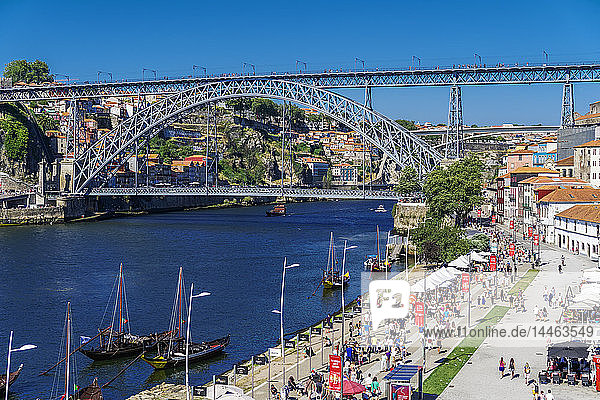 View of Dom Luis I Bridge over Douro River and Vila Nova de Gaia waterfront with Porto wine ships and Ribeira view  Porto  Portugal
