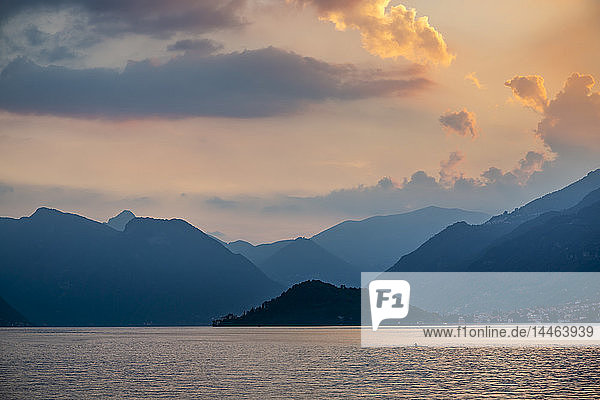 View of solitary rowing boat on Lake Como at sunset  Province of Como  Lake Como  Lombardy  Italian Lakes  Italy